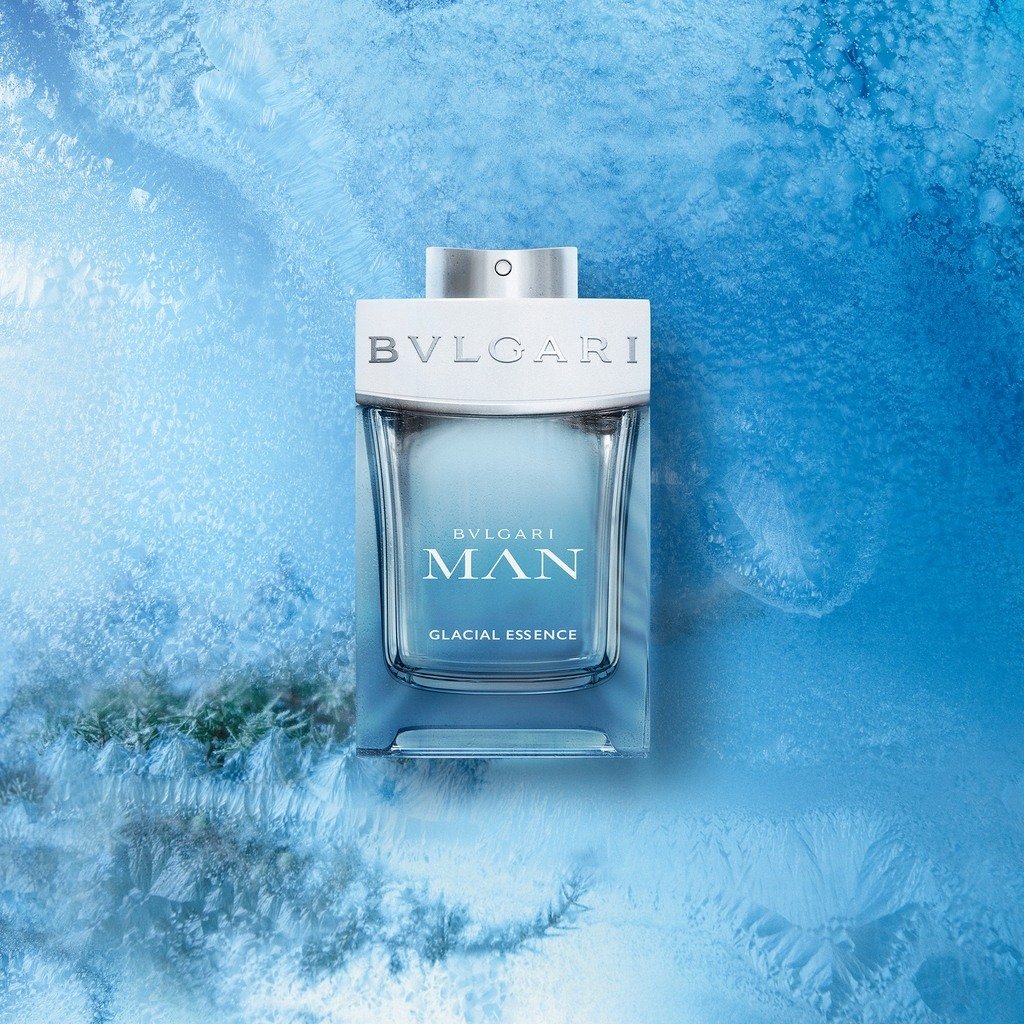 Bulgari Man Glacial Essence perfume bottle on a blue textured background