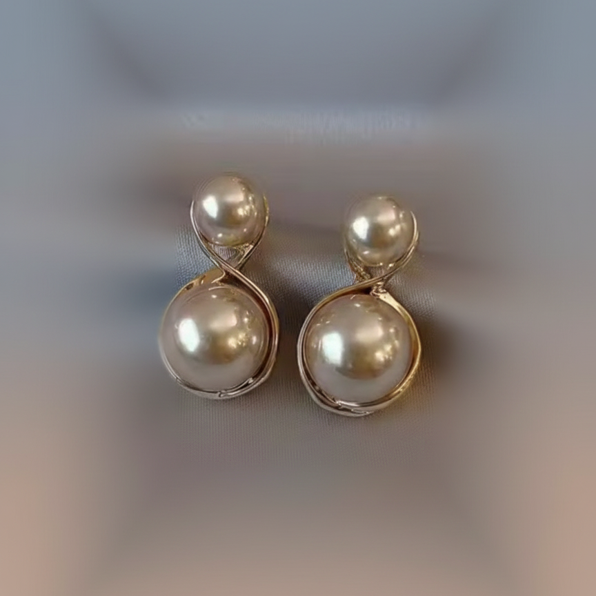 Pair of pearl earrings with gold accents