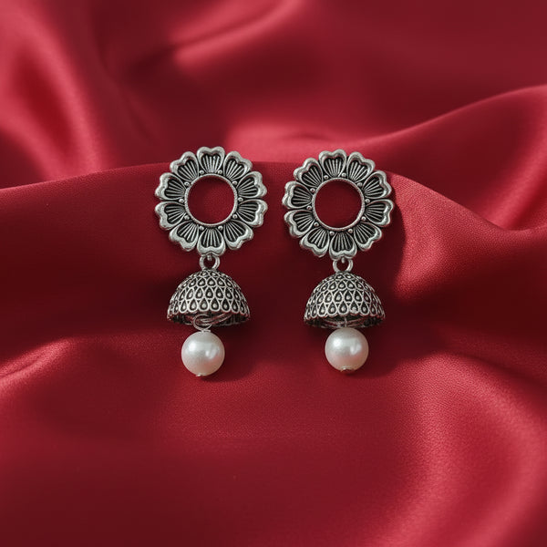 Stylish Oxidized Silver Flower Design Jhumki Earrings with Dome Detailing and Pearl Drop for Women.